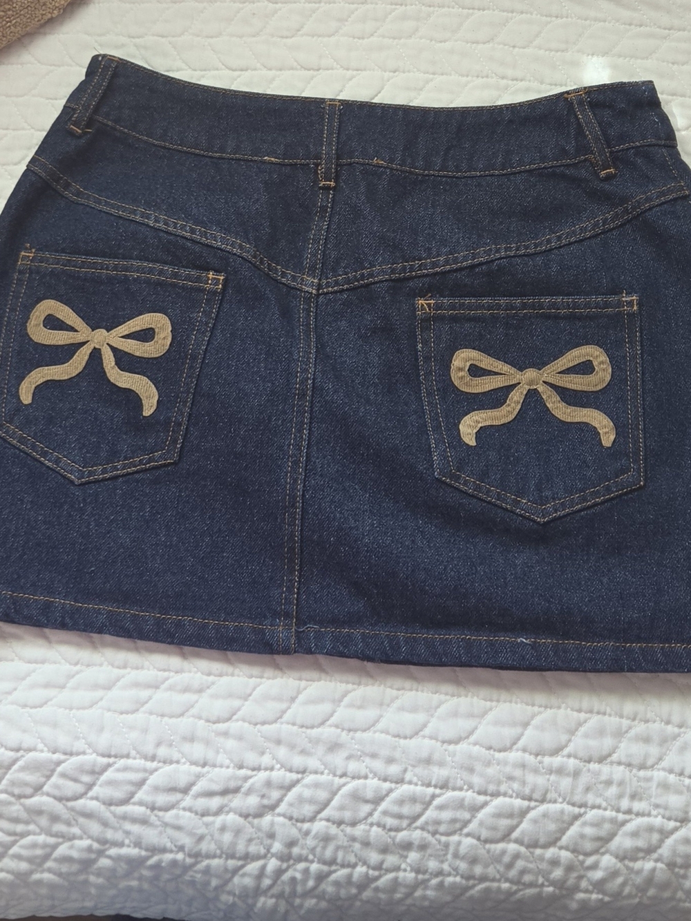 Altar'd State Dark Blue Denim Mini Skirt with Tan Bow Pocket Embroidery